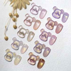 Professional manicure featuring Aurora Pearl gel polish on natural nails, glowing under light, non-toxic nail art