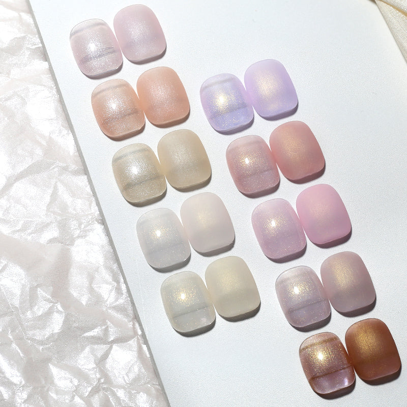Professional manicure featuring Aurora Pearl gel polish on natural nails, glowing under light, non-toxic nail art-1